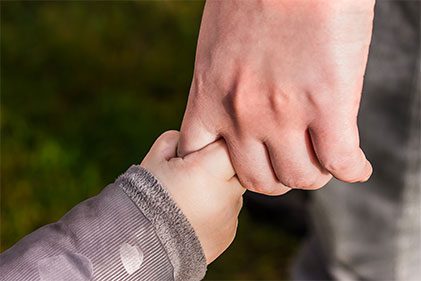 Family Lawyers in Franklin, TN | Child Custody Lawyers | Family members holding hands.